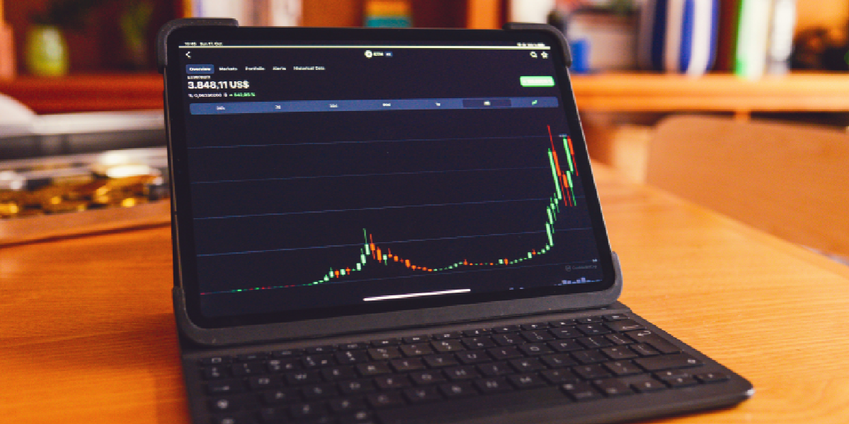 Crypto Miner iPad Air displaying cryptocurrency trading app with charts and data for a Crypto Miner