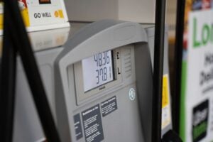 Fuel pump display showing high prices, indicating economic model and inflation trends.