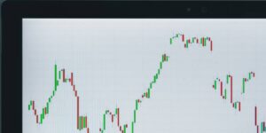 Candlestick chart displayed on a computer screen, indicating fluctuating market prices.