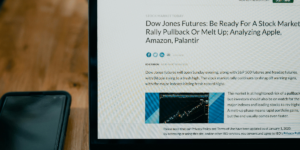 Mining Store Weekly rundown. A computer screen displaying a stock market news article titled 'Dow Jones Futures: Be Ready For A Stock Market Rally Pullback Or Melt Up; Analyzing Apple, Amazon, Palantir', with related stock charts and social media sharing icons.