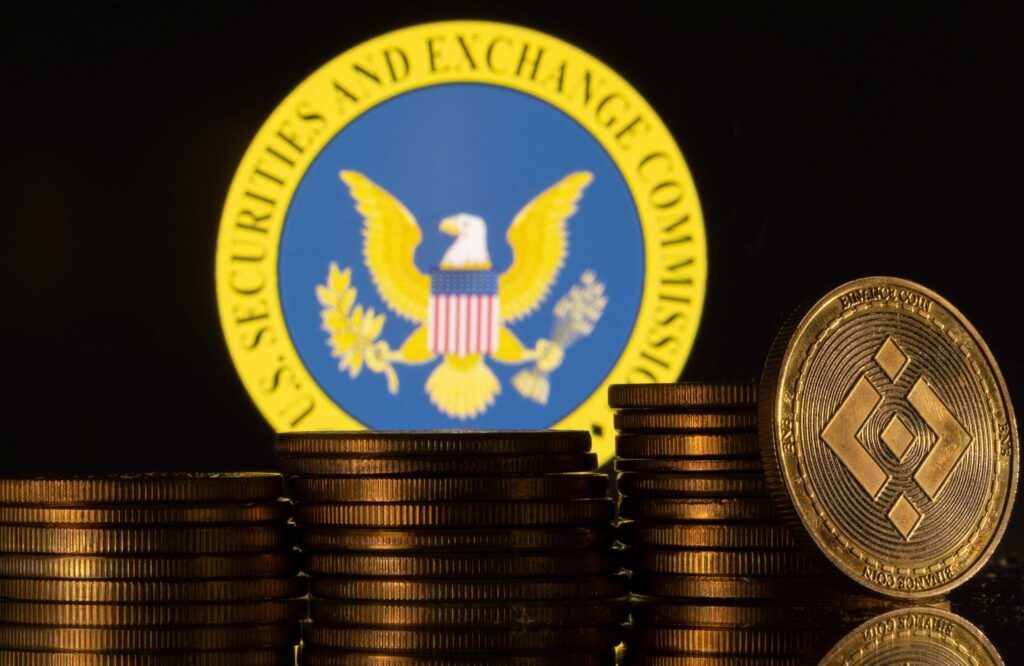 SEC logo at the back of stacked bitcoins