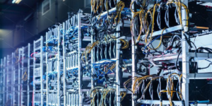 "Dense array of cryptocurrency mining equipment at a hosting facility, prompting 'Is Bitcoin mining profitable?