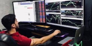 Trader analyzing cryptocurrency market data on multiple screens