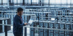 Technician managing operations in a large-scale crypto hosting facility