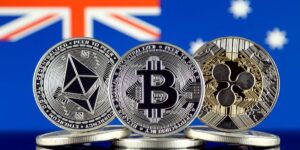 Ethereum, Bitcoin, and Ripple coins displayed in front of the Australian flag 