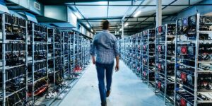 Person walking through a large bitcoin mining pool filled with rows of ASIC and GPU mining rigs.