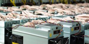 Rows of ASIC bitcoin miners operating in a large-scale bitcoin mining pool facility