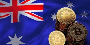 Bitcoin coins displayed against the Australian flag, representing crypto adoption in Australia.