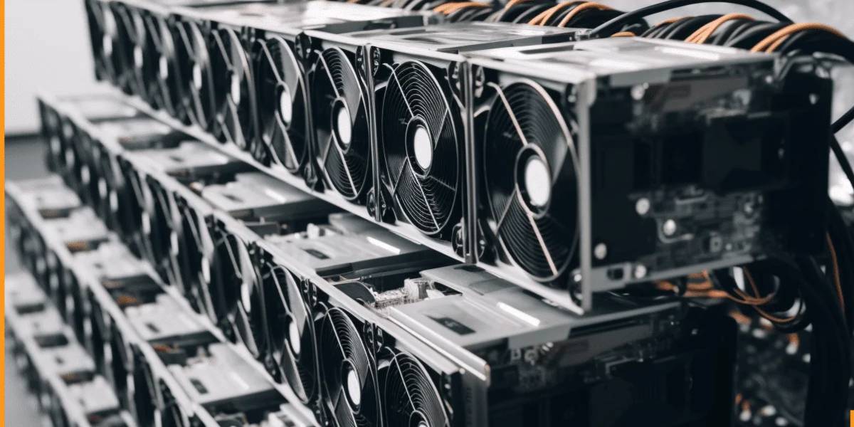 Rows of ASIC miners with cooling fans inside a cryptocurrency mining facility