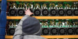 Crypto miner hosting facility with ASIC mining rigs installed on industrial racks