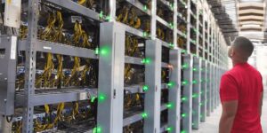 Crypto miner hosting facility with rows of mining rigs, network cables, and equipment monitoring lights.