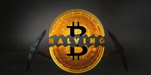 Bitcoin halving concept with a split Bitcoin coin and mining pickaxes.