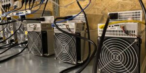 ASIC miners with power cables and cooling fans for cryptocurrency mining in Australia.
