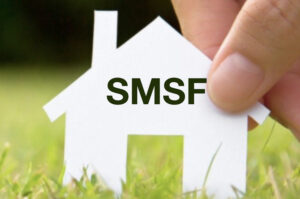Hand holding a paper house labelled SMSF, representing a Self Managed Super Fund in Australia.
