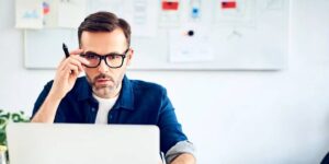 Man reviewing cryptocurrency information on a laptop